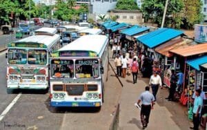 Buses waiting for clients in a busy street in Colombo