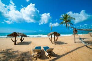 Beautiful Sandy Beach with Blue Sky and Coconut Tree